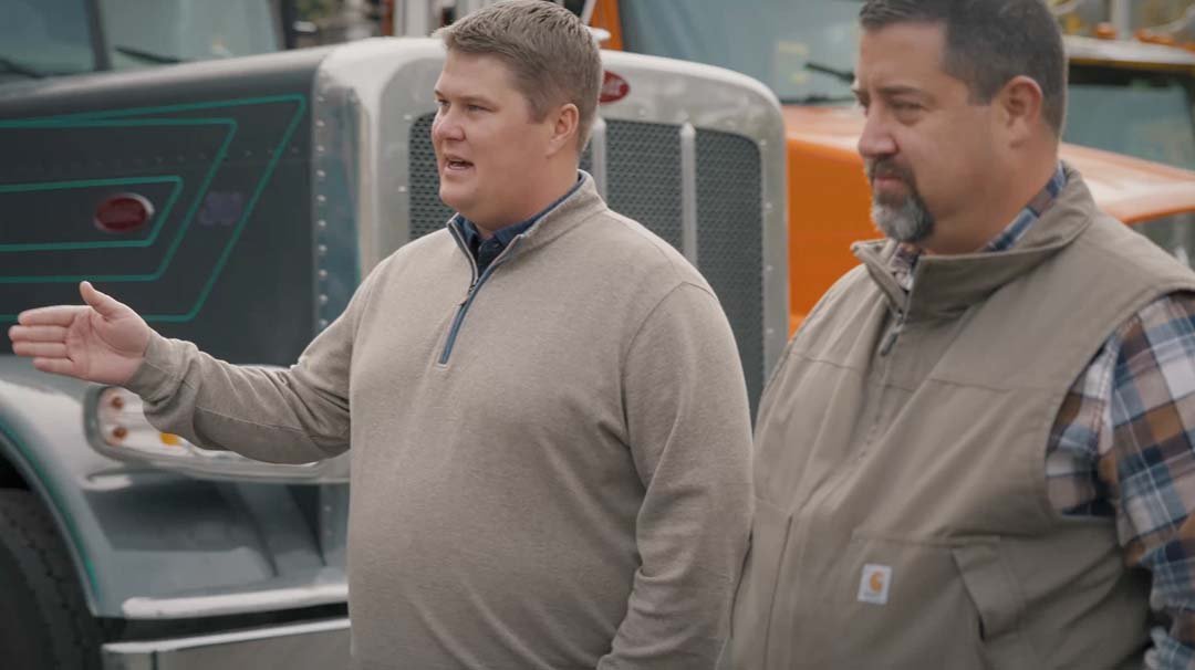 Logan Haugen on a worksite with industrial equipment